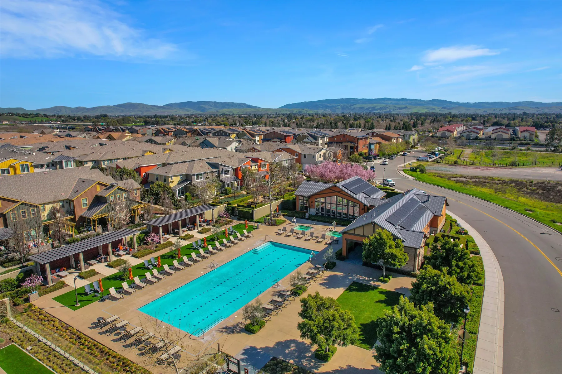 Aerial view of the Sage community swimming pool, residences and surrounding hills